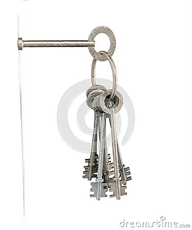 Keys Inserted Into White Wall Stock Photo