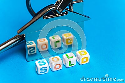 Keys with a keychain form the house and the inscription on the sale Stock Photo