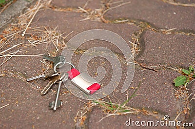 Keys on pavement outdoors, space for text. Lost and found Stock Photo