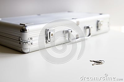 Keys resting on the table to open or close the briefcase Stock Photo