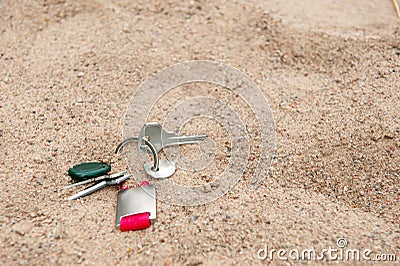 Keys on sand, space for text. Lost and found Stock Photo