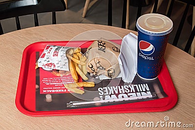 KFC menu with Kentucky Classic BBQ Burger, french fries and Mirinda for drink Editorial Stock Photo