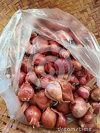 1 kg of onions in a plastic bag Stock Photo