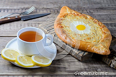 Khachapuri in Adjara with cheese and egg. Stock Photo