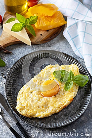 Khachapuri, Georgian cuisine meal. Baked cottage cheese pumpkin bread with cheese and egg filling on stone background. Healthy Stock Photo