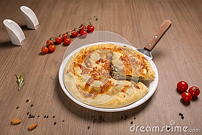 Khachapuri with meat and cilantro beef, sulguni, onion Stock Photo