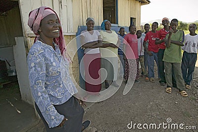 Khadija Rama, standing with a group of people, is the founder of Pepo La Tumaini Jangwani, HIV/AIDS Community Rehabilitation Editorial Stock Photo