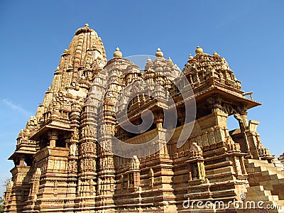 Khajuraho Temple Group of Monuments in India with erotic sculptures on the wall Stock Photo