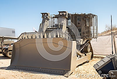 Armored military bulldozer presented on military show Stock Photo