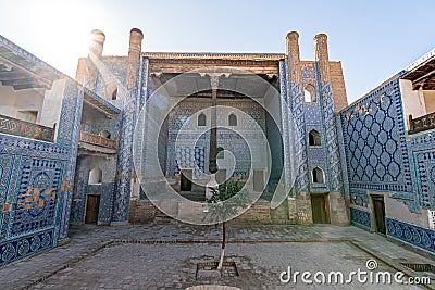 Khan palace with carved wooden column and walls with beautiful intricate ornament tiles in old city of Ichan-Kala Stock Photo