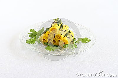 Khandvi Indian Vegetarian Food Stacked on a Glass Plate Stock Photo