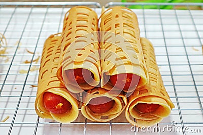 `Khanom Tokyo` Rolled Pancake Stuffed With Sausage Stock Photo