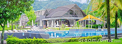 Khao Lak, Thailand, June 1, 2019: panorama fragment of the Sands hotel with a swimming pool against a background of green trees Editorial Stock Photo