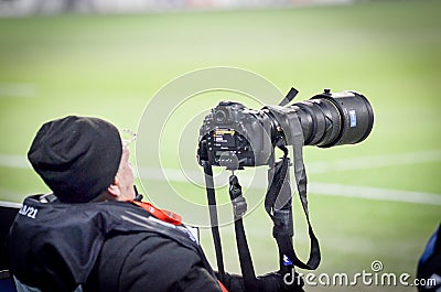 KHARKIV, UKRAINE - February 14, 2019: Photographers, journalists with cameras shoot a match during the UEFA Europa League match Editorial Stock Photo
