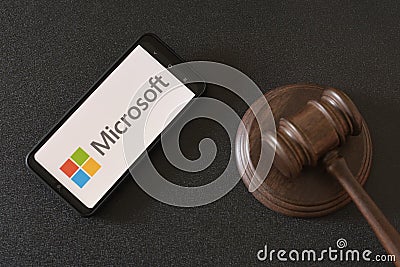 KHARKIV, UKRAINE - JUNE 25, 2020: Microsoft Corporation logo on screen of mobile device. Disputes and lawsuits against Microsoft Editorial Stock Photo