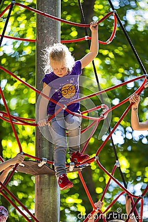 A new popular children`s attraction is an extreme spruce with flying children of adolescence. Editorial Stock Photo