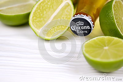 KHARKOV UKRAINE - DECEMBER 9 2020: Bottle of Corona Extra Beer with lime slices. Corona produced by Grupo Modelo with Anheuser Editorial Stock Photo