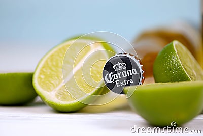 KHARKOV, UKRAINE - DECEMBER 9, 2020: Bottle of Corona Extra Beer with lime slices. Corona produced by Grupo Modelo with Anheuser Editorial Stock Photo