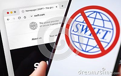 SWIFT blocked, logo close-up on mobile phone screen. Girl use S.W.I.F.T. banking and international technology concept Editorial Stock Photo