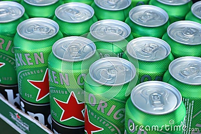 KHARKOV, UKRAINE - JULY 31, 2021: Green tin cans of Heineken lager beer produced by the Dutch brewing company Heineken N.V Editorial Stock Photo