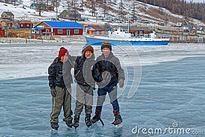 Young skaters on an natural ice rink on Khovsgol lake Editorial Stock Photo