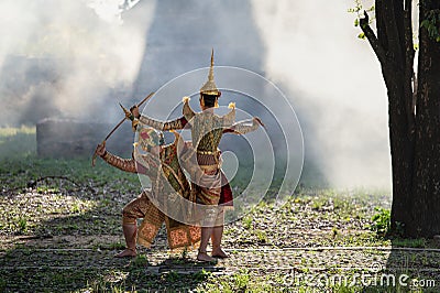 Khon is traditional Thai classic masked play enacting scenes from the Ramayana in a public place at Wat Ma Hea Yong, Stock Photo