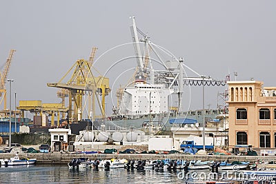 Khor Fakkan UAE Large cargo ships docked to load and unload goods at Khor Fakkport Editorial Stock Photo