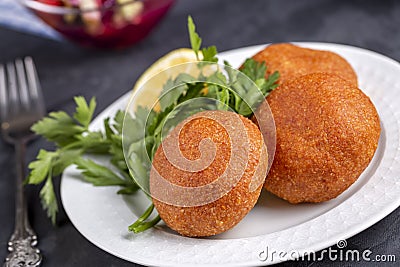 Kibbeh is a popular dish in Middle Eastern cuisine - Turkish name icli kofte - Adana icli koftesi Stock Photo