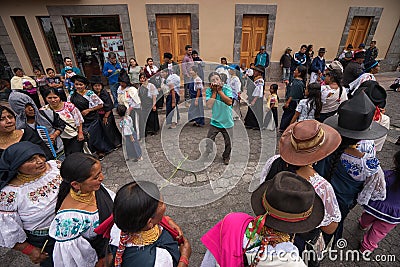 Kichwa people celebrating in Cotacachi Editorial Stock Photo