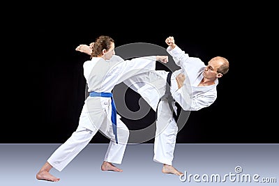 Kick leg and striking with a hand are trained by athletes Stock Photo