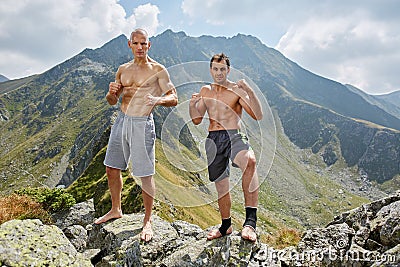 Kickboxers or muay thai fighters training in the mountains Stock Photo
