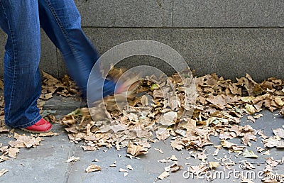 Kicking leaves Stock Photo