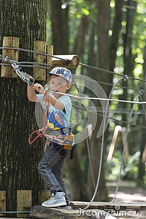 Kid in adventure park Editorial Stock Photo