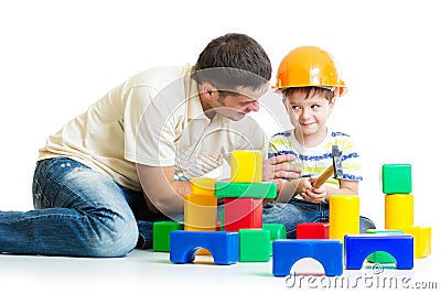 Kid boy and father play builders Stock Photo