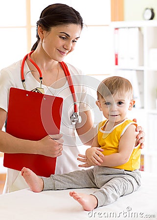 Kid boy and female doctor in medical office Stock Photo