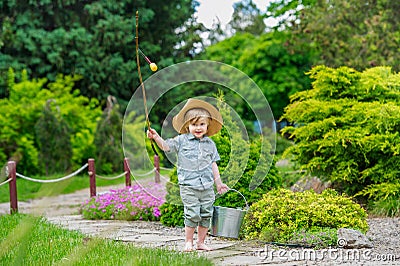 Kid with bucket and rod Stock Photo