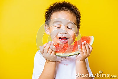 Kid cute little boy attractive laugh smile playing holds cut watermelon fresh for eating Stock Photo
