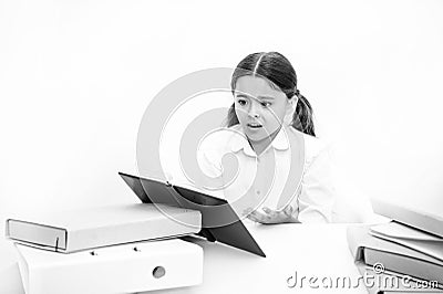 Kid cute tired of studying. Boring lesson. Boring task homework. Get rid of boring task. Girl bored pupil sit at desk Stock Photo