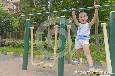 Kid doing exercise Stock Photo