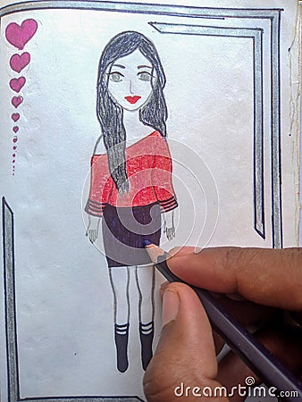 Kid drawing beautiful girl on notebook. colour pencil in hand Stock Photo