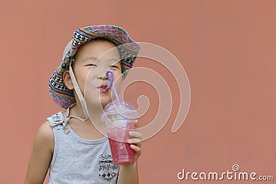 Kid drinking cold drink Stock Photo