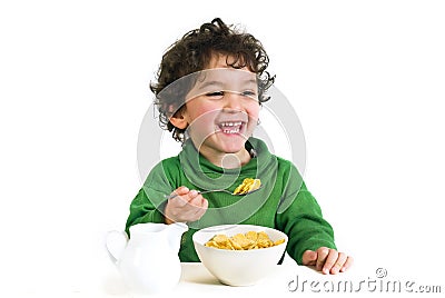 Kid eating cornflakes Stock Photo