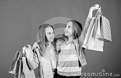 Kid fashion. shop assistant with package. Sales and discounts. Sisterhood and family. savings on purchases. Small girls Stock Photo
