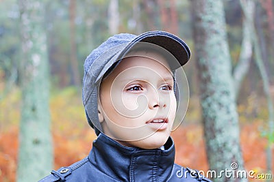 Kid fear face forest fall portrait Stock Photo