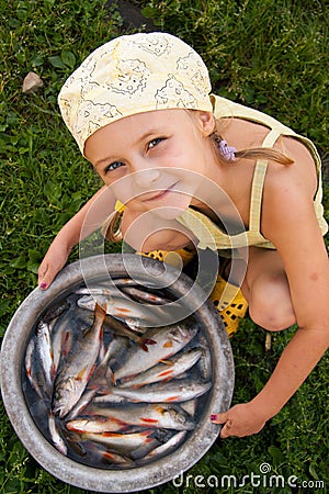 Kid and fishes Stock Photo