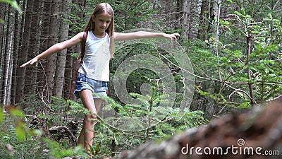 Kid in Forest Walking Tree Log, Child Playing in Park, Teenager Girl in Camping Adventure, Children in Forest Mountains Stock Photo