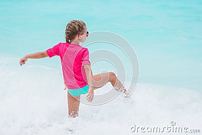 Cute little girl at beach during caribbean vacation Stock Photo