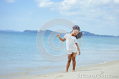 Kid girl american african playing relax enjoy life funny moment on the beach in sea vie Stock Photo