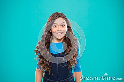 Kid girl long healthy shiny hair wear casual clothes. Little girl excited happy face. Kid happy cute face feels excited Stock Photo