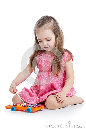 Kid girl playing musical toy Stock Photo